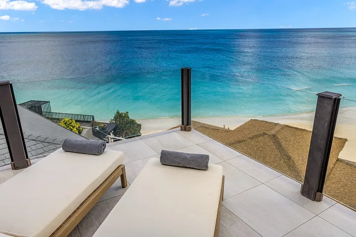 Ocean 19 | Oceanfront Living, 3-bedroom villa for sale in St Mary, Antigua & Barbuda - roof terrace loungers overlooking the beach