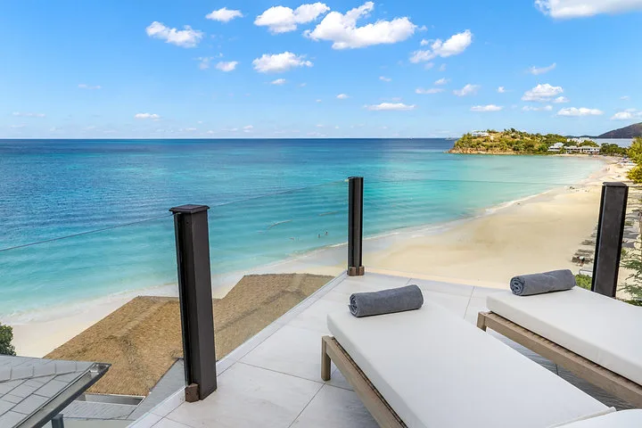 Ocean 19 | Oceanfront Living, 3-bedroom villa for sale in St Mary, Antigua & Barbuda - sun loungers on the roof terrace above the beach
