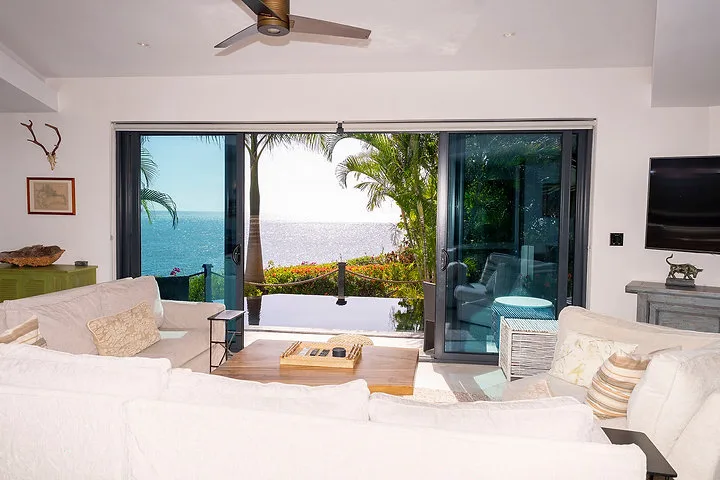 Villa Oasis | Private Garden and Ocean Views, 2-bedroom villa for sale in St Mary, Antigua & Barbuda - living room opening onto the pool