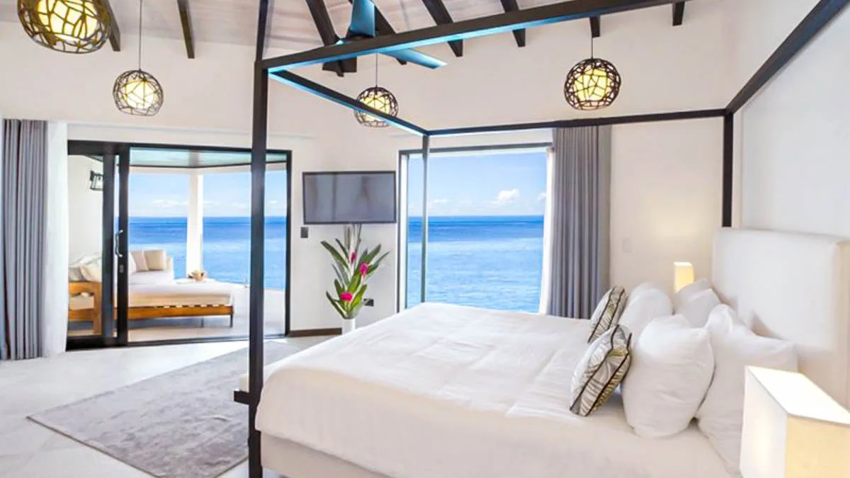 Tamarind Hills Villas | Luxury Beachfront Residences in Antigua, 1-bedroom villa for sale in St Mary, Antigua & Barbuda - four-poster bedroom with sea views