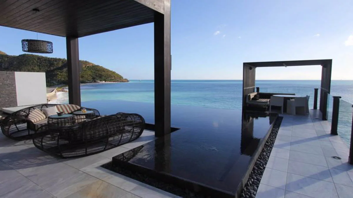 Tamarind Hills Villas | Luxury Beachfront Residences in Antigua, 1-bedroom villa for sale in St Mary, Antigua & Barbuda - terrace lounge and pool over the sea