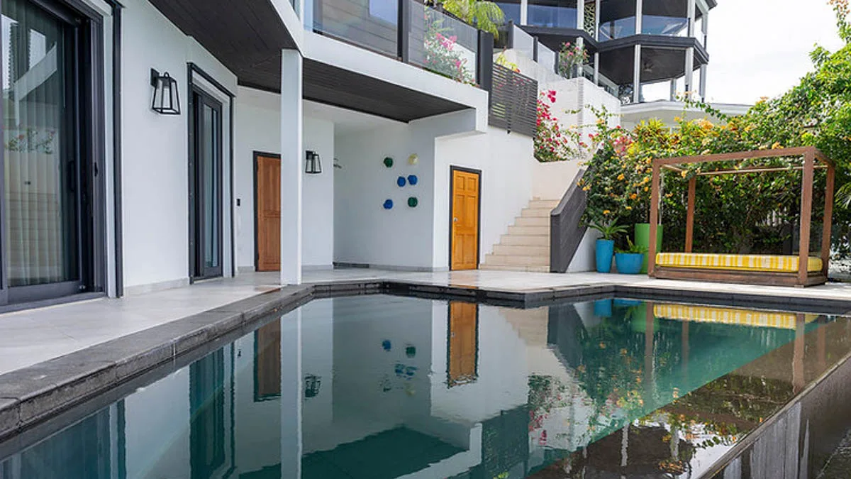 Villa Ocean 15 | Oceanfront Infinity Pool, 4-bedroom villa for sale in St Mary, Antigua & Barbuda - pool beside the lower floor