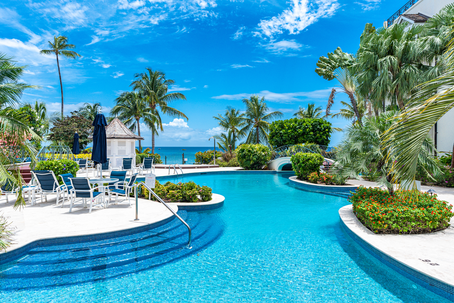 Pool and sea view at Beach Happy Schooner Bay, a great choice for accommodation for Barbados on a budget