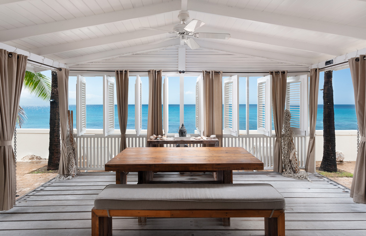 Deck and dining at beachfront Barbados villa, Little Good Harbour House